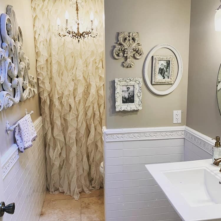 elegant bathroom with frilly shower curtain 