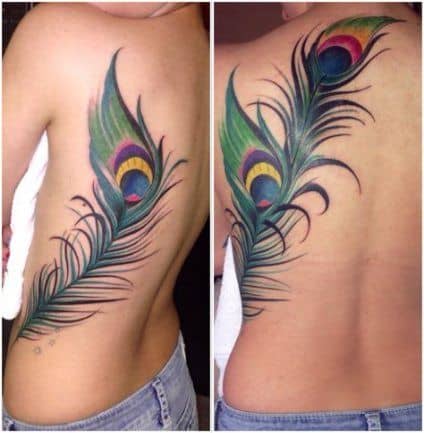 Peacock feather tattoo on the left shoulder blade
