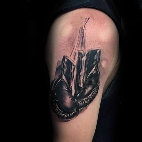 Tattoo artist at work. Woman in black latex glove tattooing a young man's  hand with colorful picture in studio. Close up. | Stock image | Colourbox