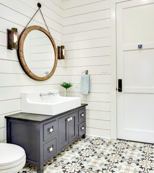 pattern design floor tiles gray cabinet round wood mirror