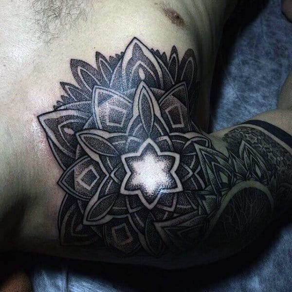 Amazing Male Chest Impressive Black Dotwork Tattoo With Bright White Centre