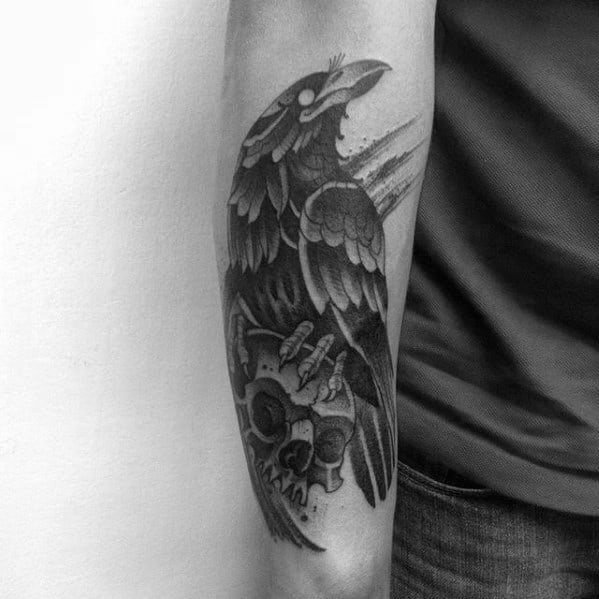 Amazing Outer Forearm Male Traditional Crow And Skull Shaded Tattoo