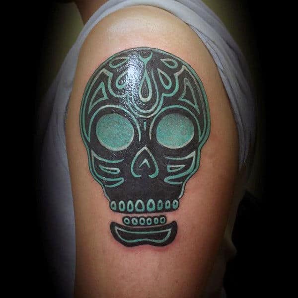 Amazing Sugar Skull Tattoos Guys Tribal Style On Upper Arm With Green And Black Ink