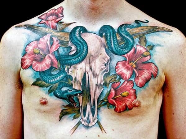 animal-skull-with-snake-and-hibiscus-flowers-mens-chest-tattoo