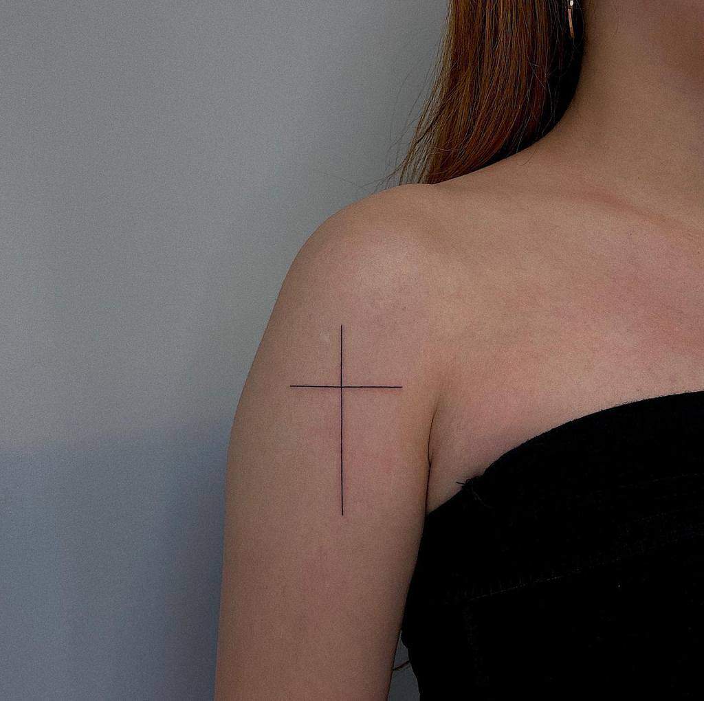 arm cross tattoos for women taker_tattooer