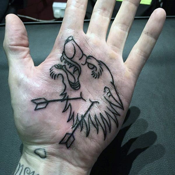 arrow-piercing-furry-dog-tattoo-male-palms