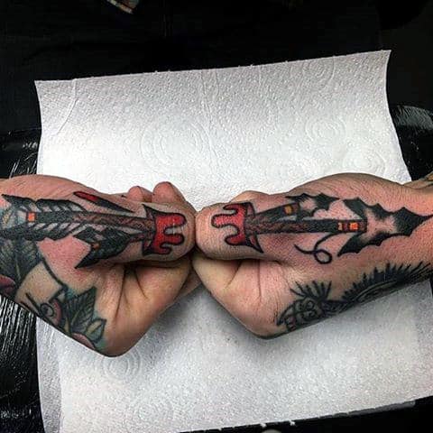 Arrow Through Skin Thumb Tattoo On Male
