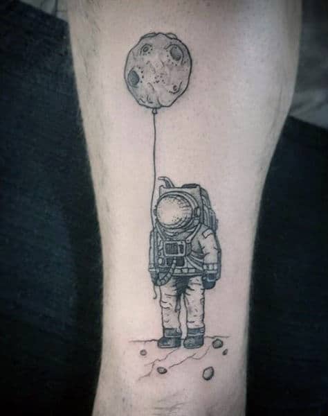 Astronaut Holding Planet Balloons