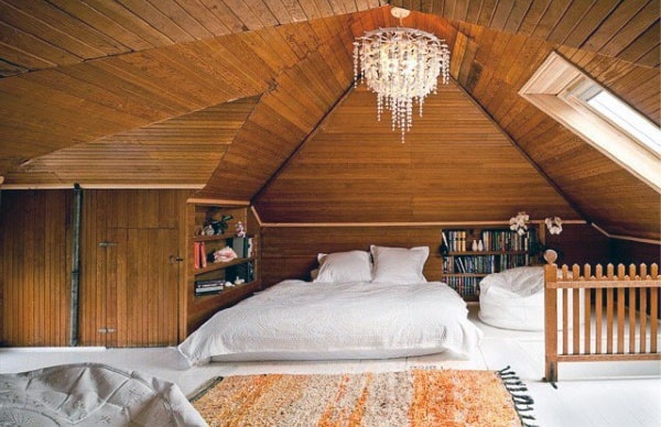 attic bedroom wood ceiling chandelier platform bed