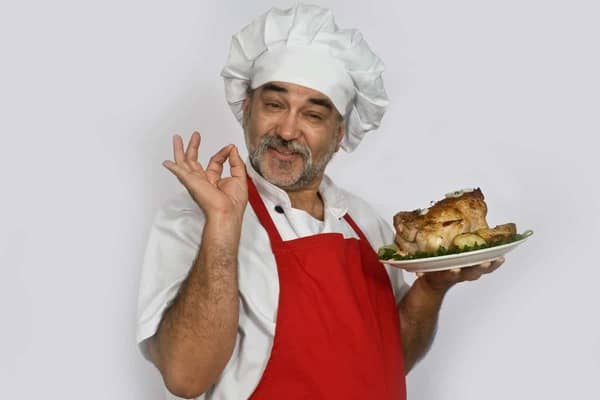 attractive chef with chicken