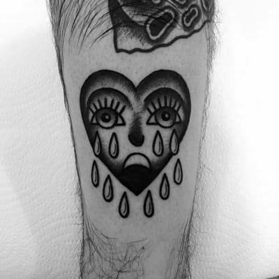 Awesome Black And Grey Ink Small Crying Heart Tattoos For Men