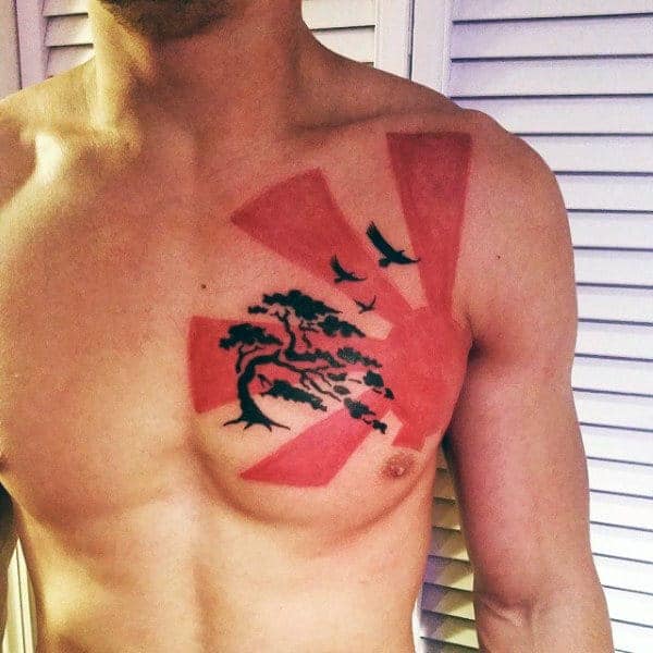 awesome-black-and-red-ink-guys-chest-tattoo-of-rising-sun-with-bonsai-tree-and-flying-birds