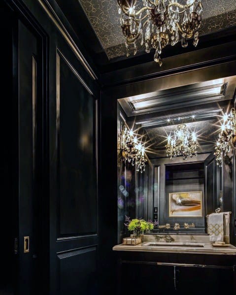 black bathroom with chandeliers