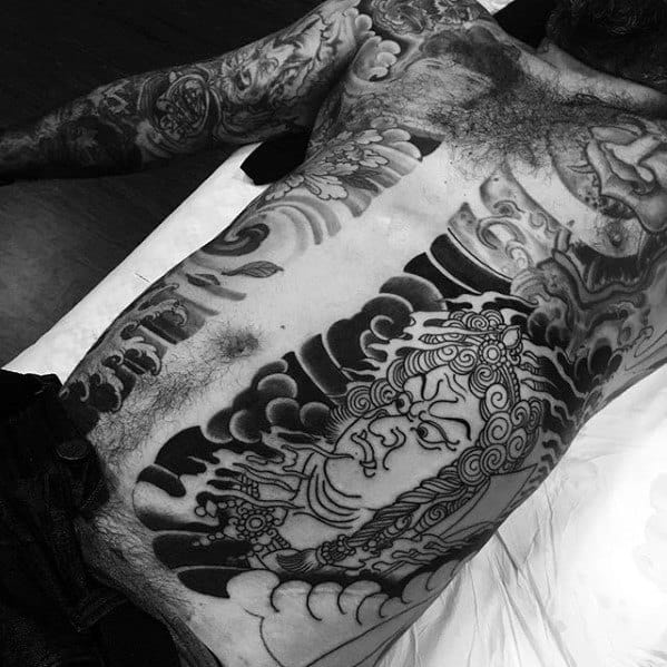 Awesome Black Ink Japanese Rib Cage Side And Chest Fudo Myoo Tattoos For Men