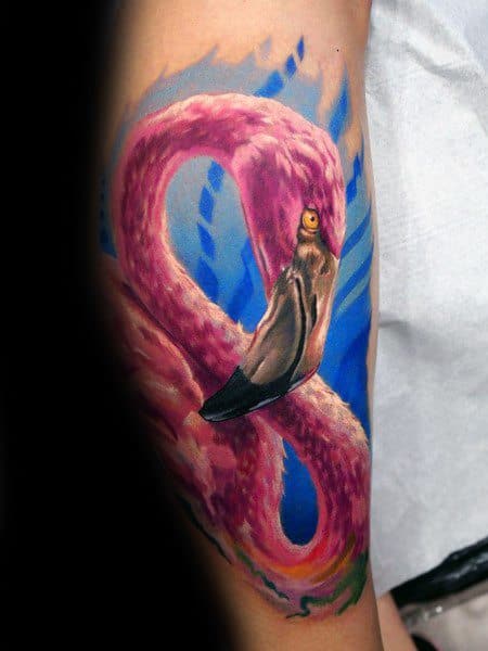 Polygonal pink flamingo tattoo on the inner forearm