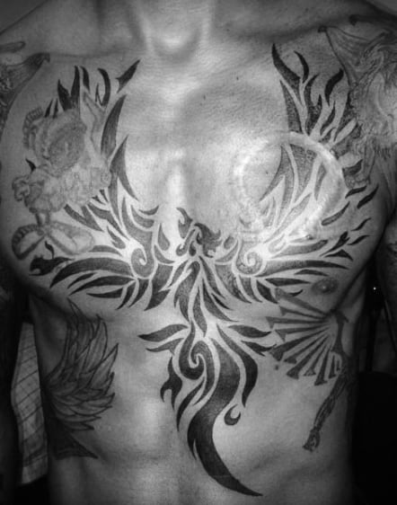 Awesome Guys Chest Tattoo Of Tribal Phoenix With Black Ink Design