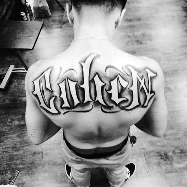 Awesome Last Name Negative Space Back Tattoos For Males
