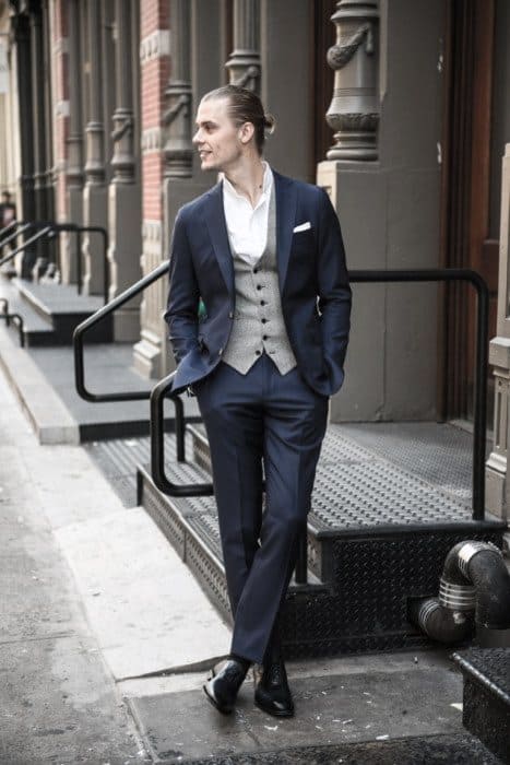 navy suit with white shoes