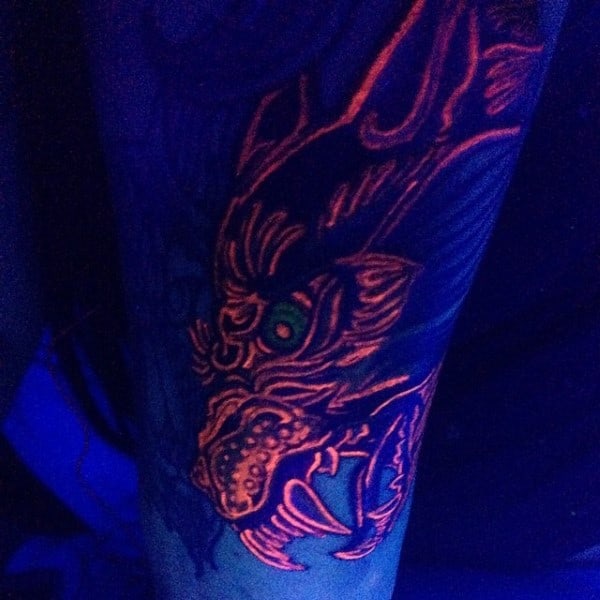 Awesome Old School Arm Dragon Orange Glowing Uv Ink Male Tattoo Design Inspiration