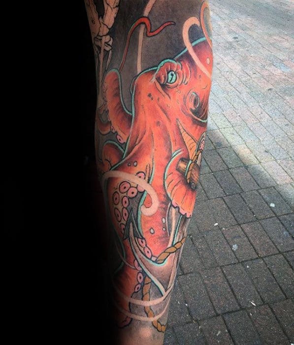 Awesome Orange Japanese Octopus Male Sleeve Tattoo On Leg