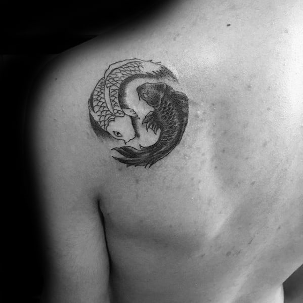 Awesome Shoulder Blade Yin Yang Koi Fish Tattoos For Men