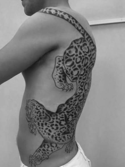 Leopard print shoulder tattoo with shaded edges  Leopard print tattoos Cheetah  print tattoos Animal print tattoo