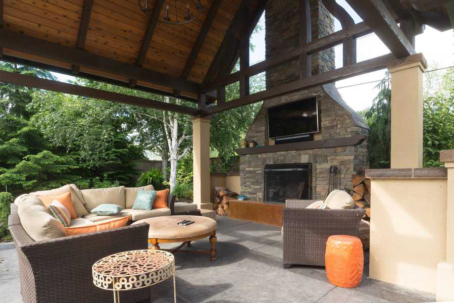 backyard terrace custom designed shelter and fireplace