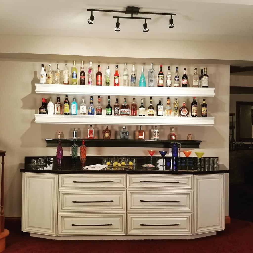 white liquor cabinet bottles on shelves 