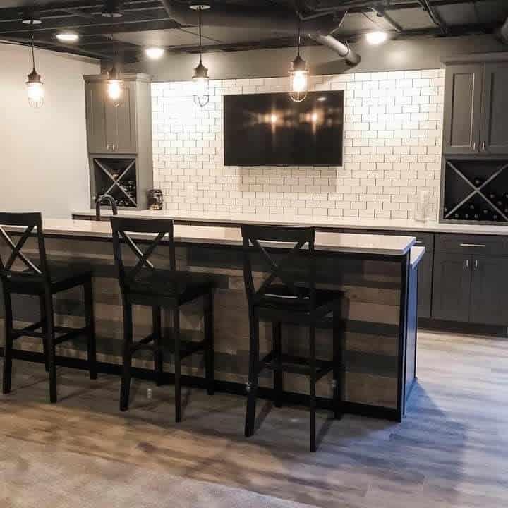 simple basement bar with white tile backsplash 