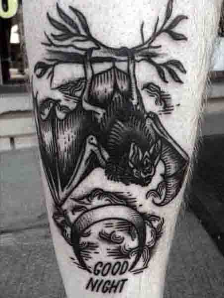 Bat With Moon Tattoo And Words Good Night On Mans Leg
