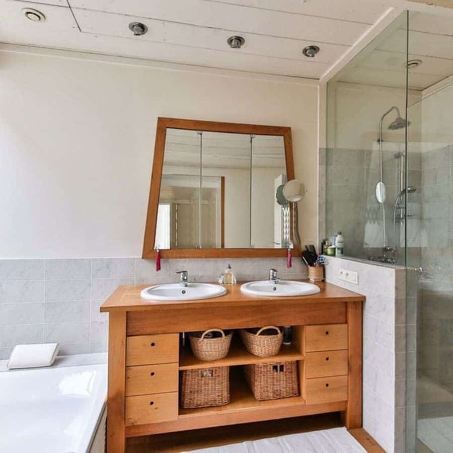 modern farmhouse bathroom with wood cabinet vanity 