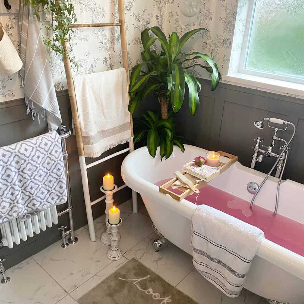 bathroom with floral wallpaper gray wall paneling freestanding claw bathtub