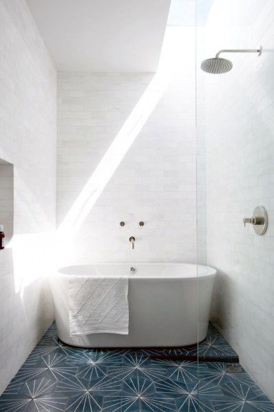 small modern bathroom freestanding tub blue pattern floor tiles 