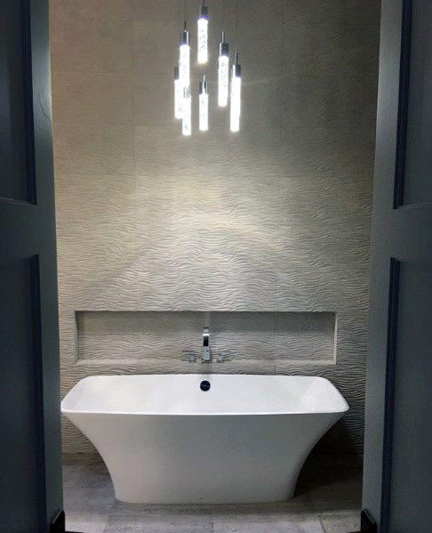 large white bathtub textured tile wall