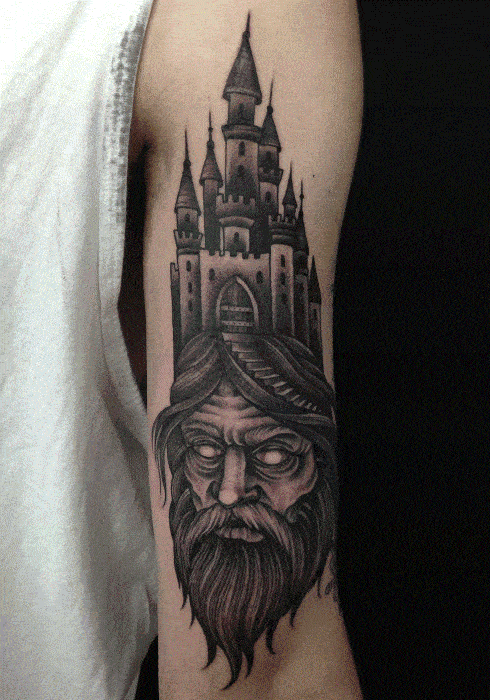 Bearded Man With Castle Head Arm Tattoo For Men In Black Ink