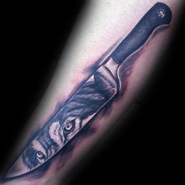 negative space chef knife tattoo