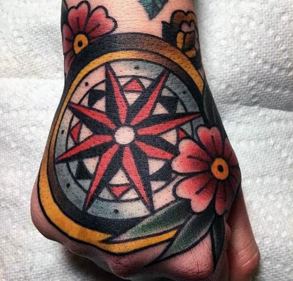 beautiful-red-nautical-star-tattoo-mens-hands