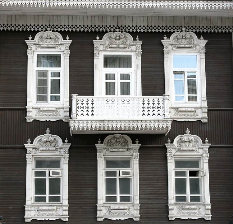 beautiful white ornate exterior window trim balcony 