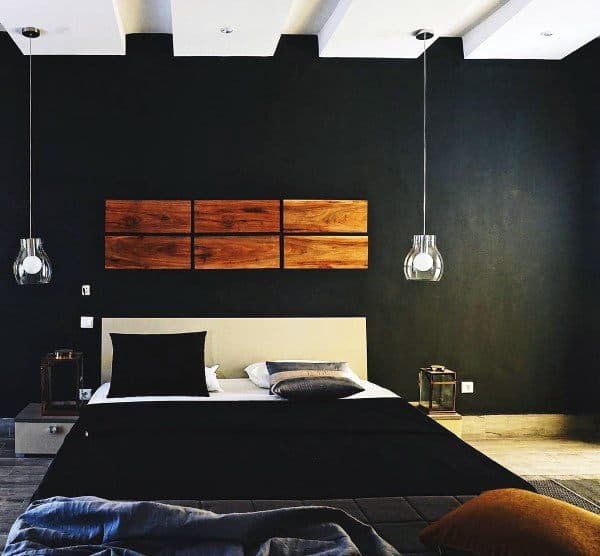 black bedroom with wood wall decor 