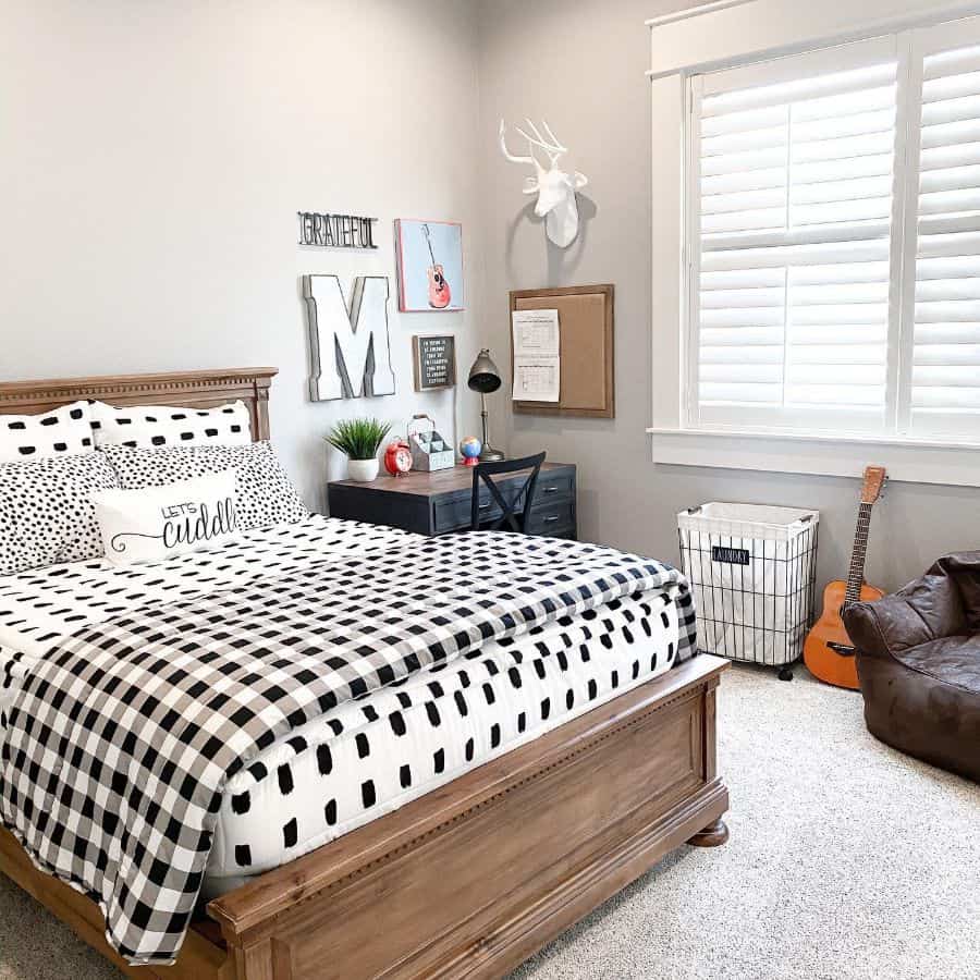 small kids bedroom with wood bed and desk 