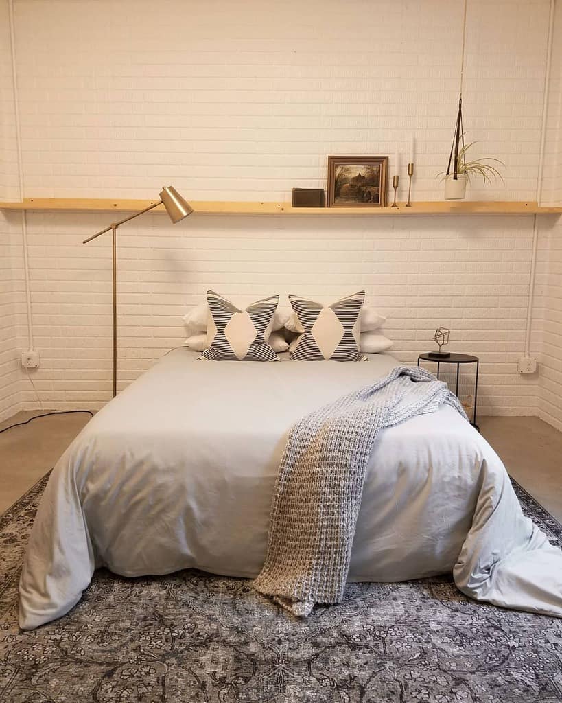 minimalist basement bedroom with platform bed