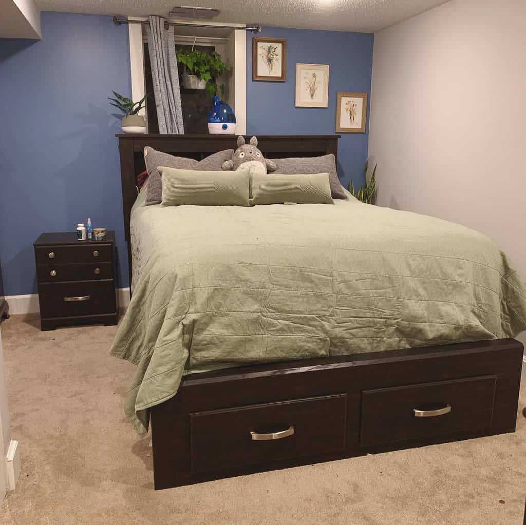 blue accent wall small bedroom with under bed storage 