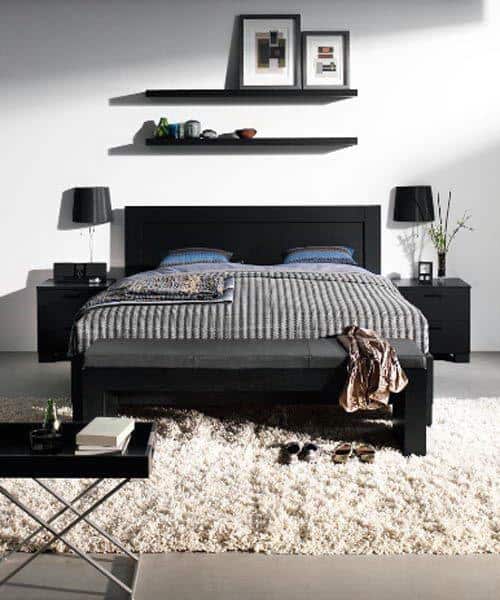 simple black bed shag rug wall shelves 