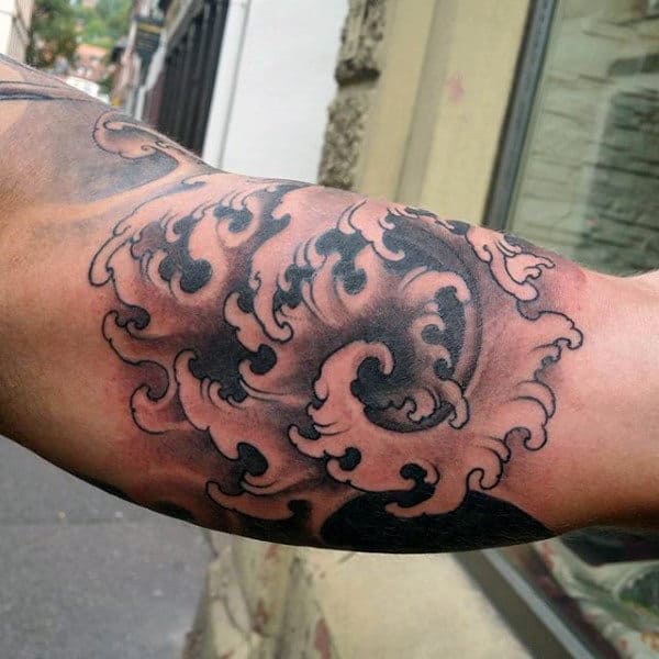 Bicep Guy's Chinese Wave Tattoo.