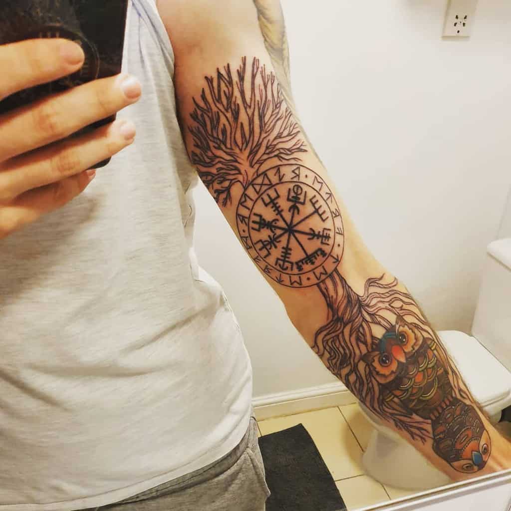big yggdrasil with owl arm tattoo