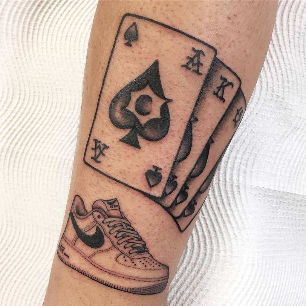 ace of spades tattoo forearm
