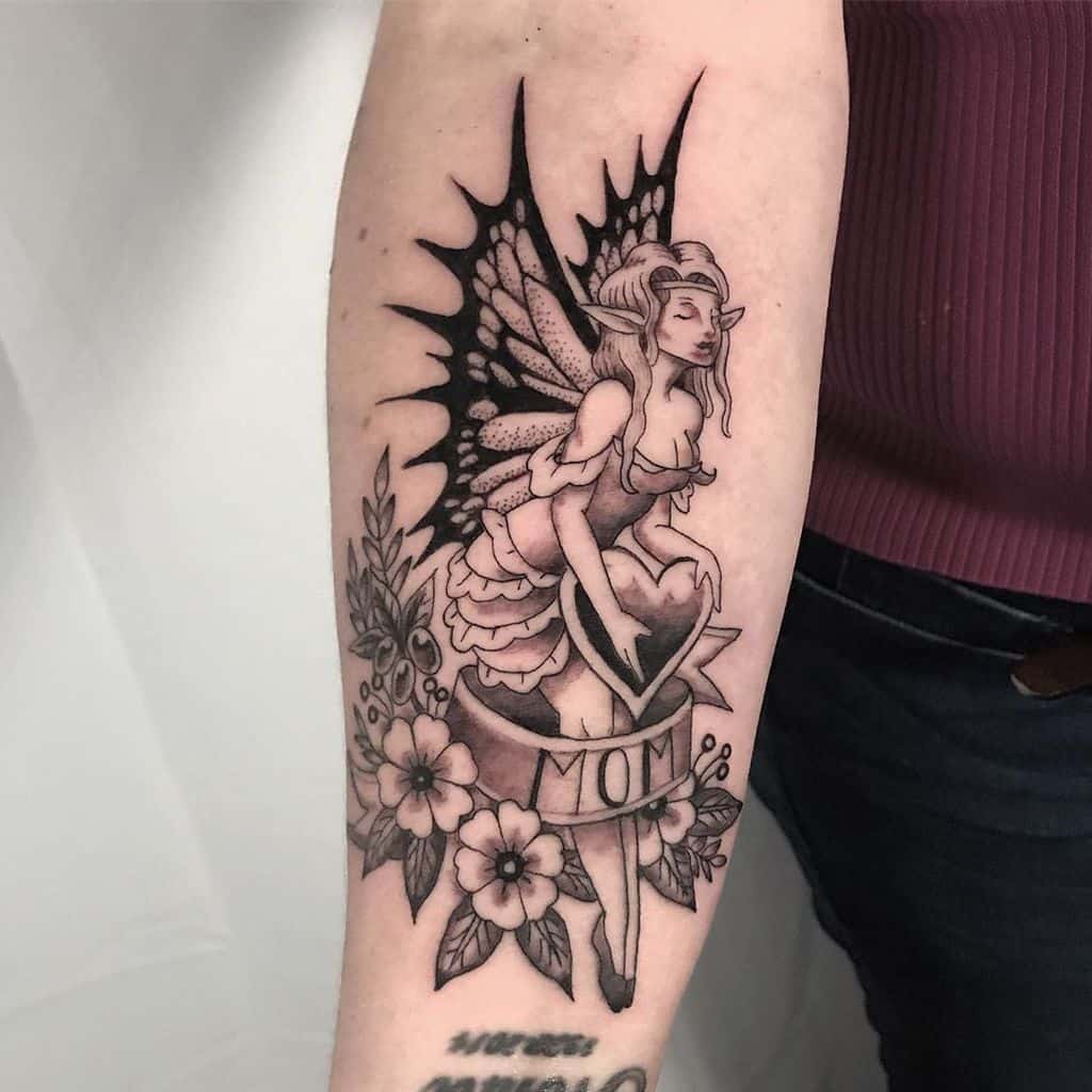Black And Grey Dainty Traditional Fairy Tattoo
