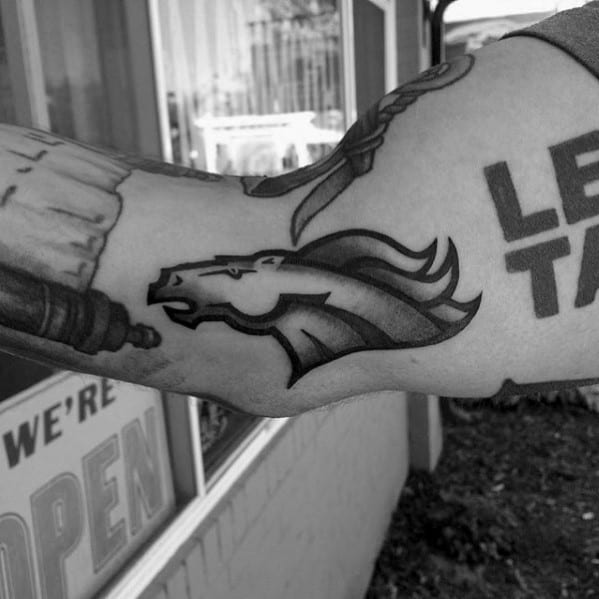 Black And Grey Denver Broncos Tattoo On Mans Inner Arm