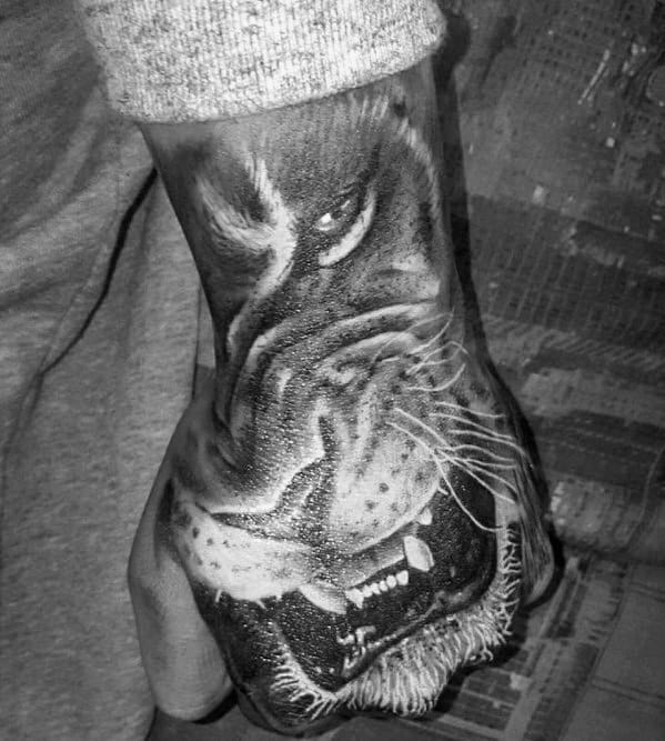 Black And Grey Ink Mens Lion Hand Tattoo