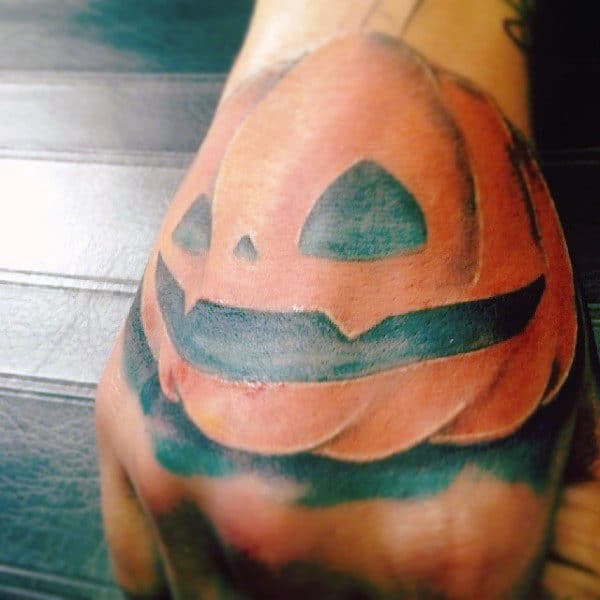 Black And Orange Ink Pumpkin Hand Mens Tattoos